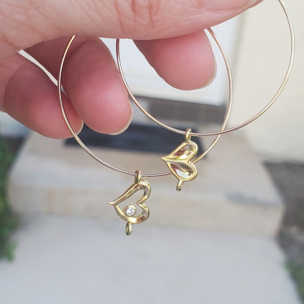 Thin wire hoops with 18k yellow gold Judith Ripka heart charms